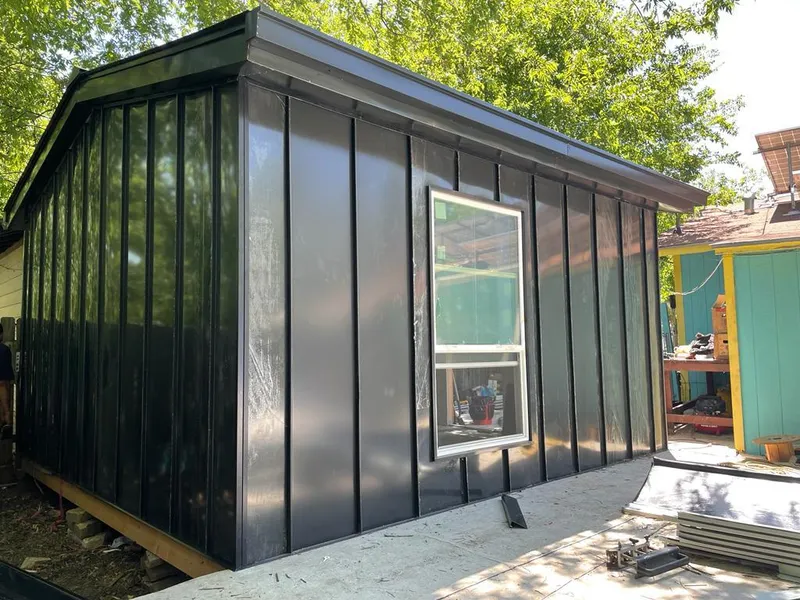 Black standing seam metal wall panels for Roof Inspection in Benson